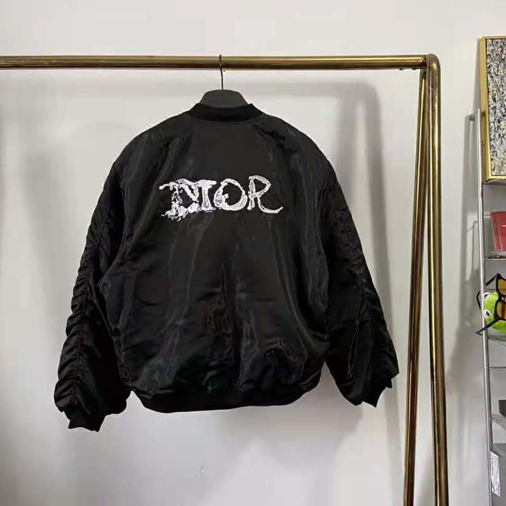 Side angle showing silhouette of Dior Men Peter Doig Bomber Jacket Black Technical Satin