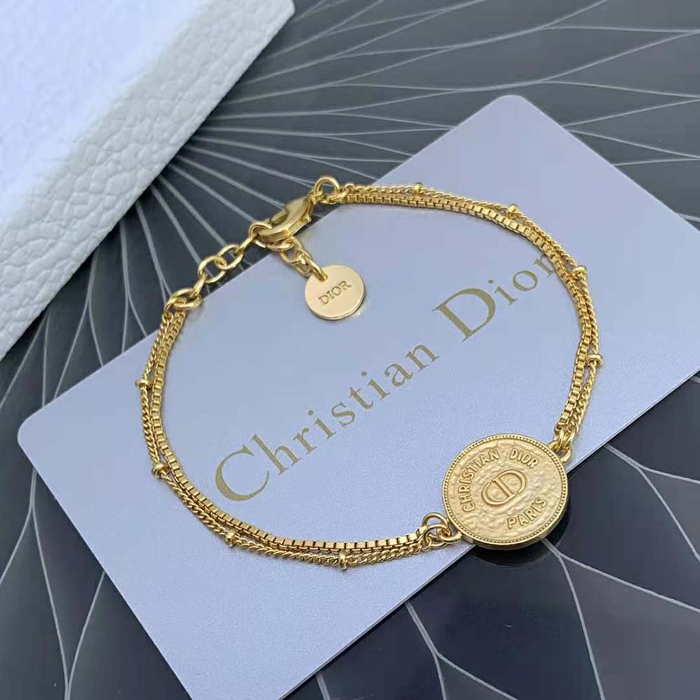 Elegant wrist shot showcasing Dior Women 30 Montaigne Bracelet in gold
