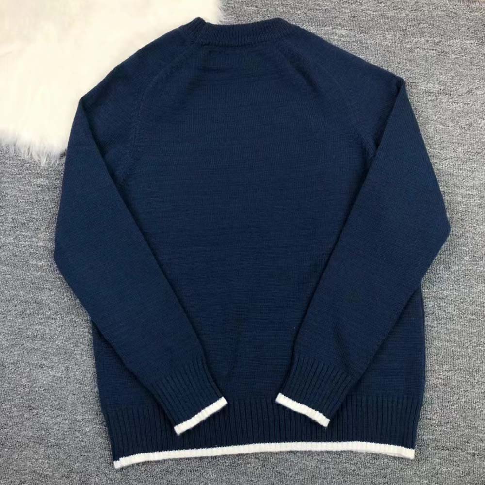 Side profile showing relaxed fit of Dior Women Christian Dior Atelier Sweater