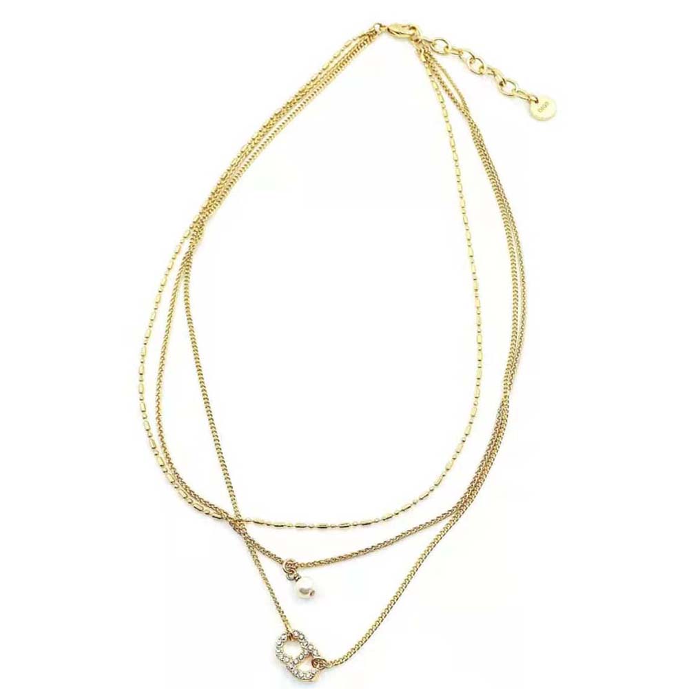 Dior Women Clair D Lune Necklace worn at collarbone with gold tone sparkle