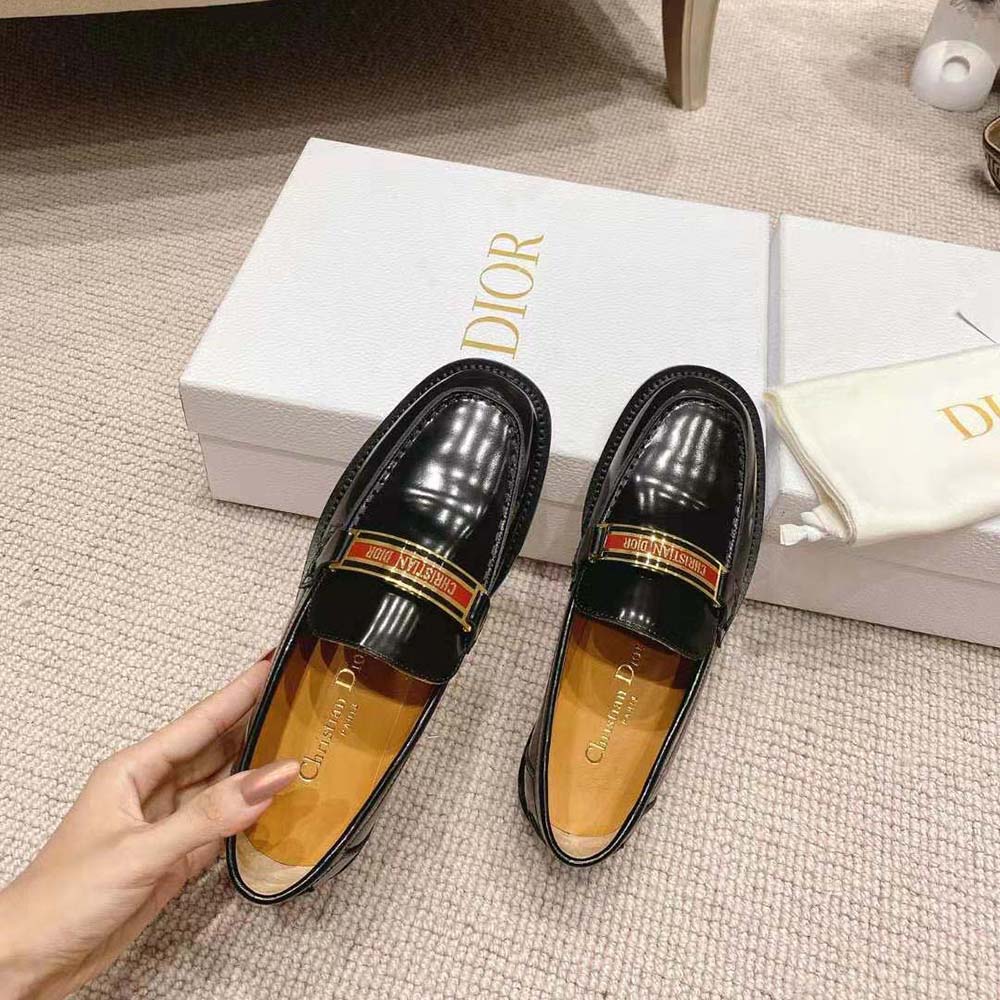 Close-up of brushed calfskin and Dior hardware on loafer