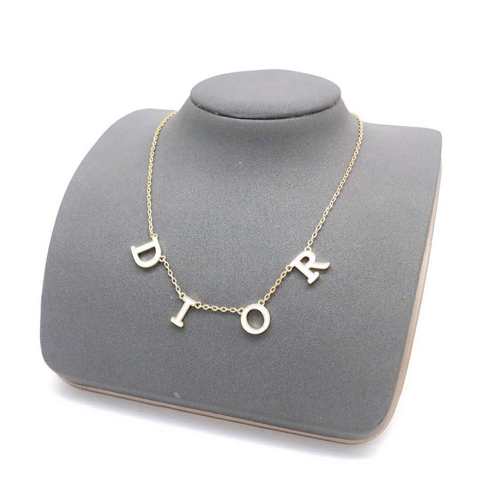 Close-up on clasp and white lacquer detail of Dior Women Dio(r)evolution Necklace