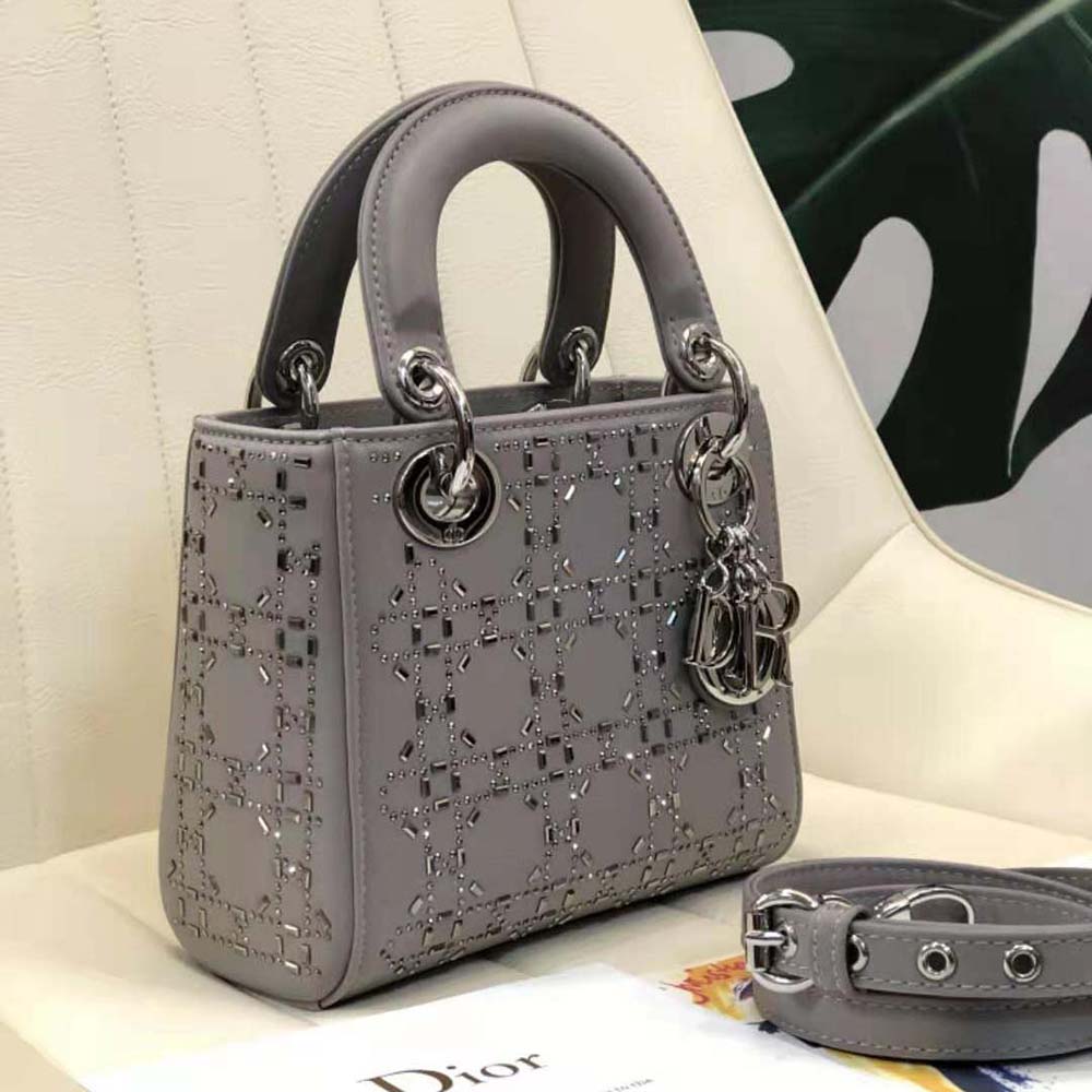 Side angle showing silver hardware and zipper on Dior Women Mini Lady Dior Bag