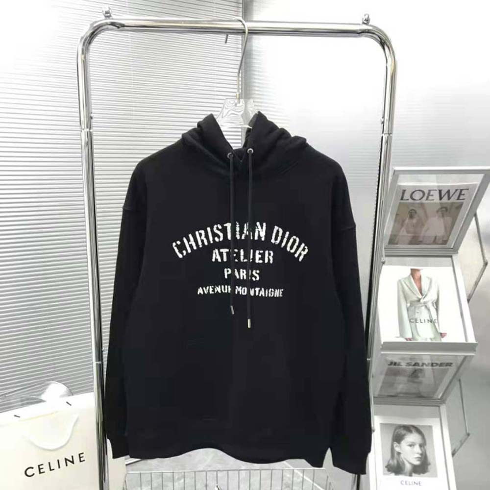 Close-up of Christian Dior Atelier logo on black cotton fleece sweatshirt