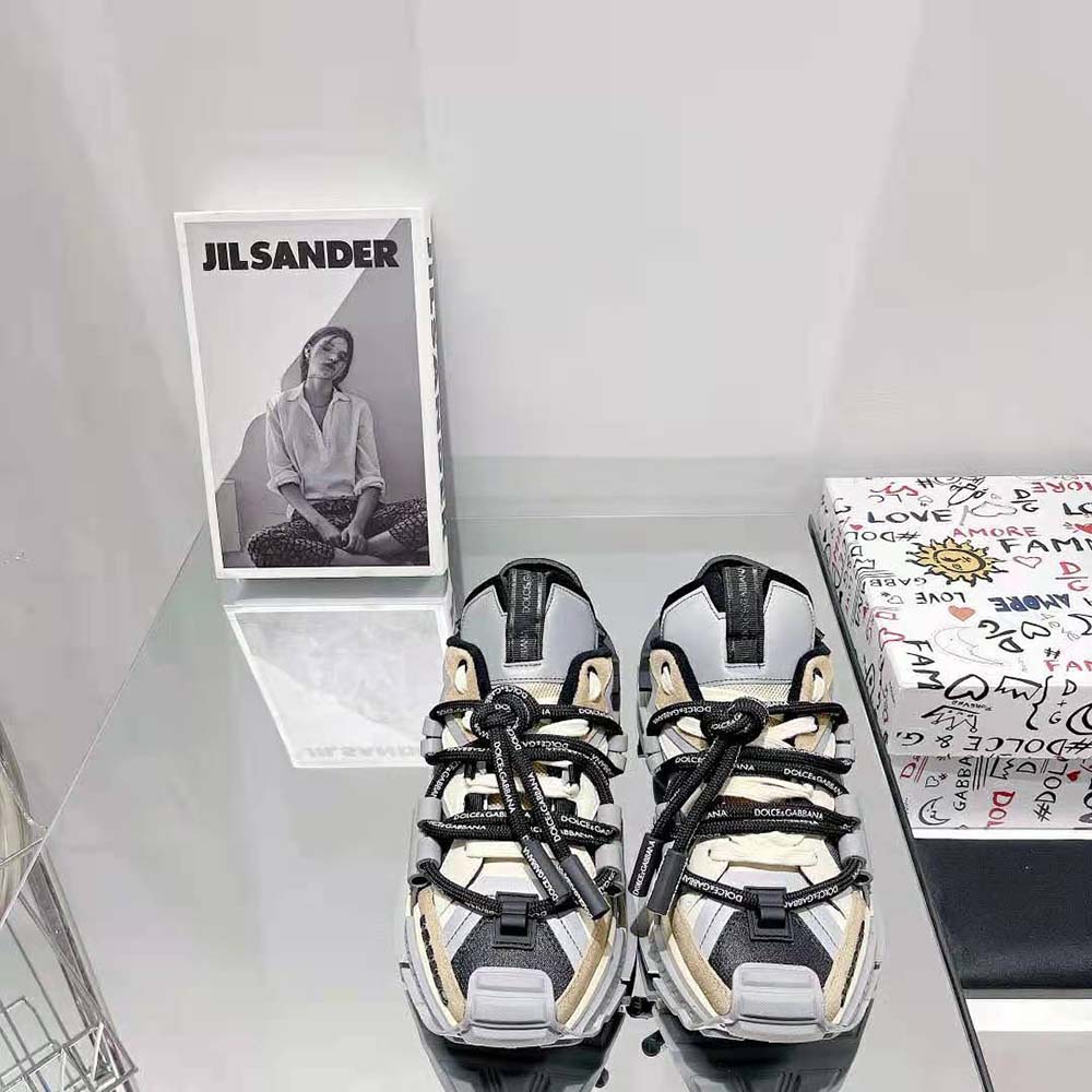 Close-up on signature D&G hardware on space sneakers in brown