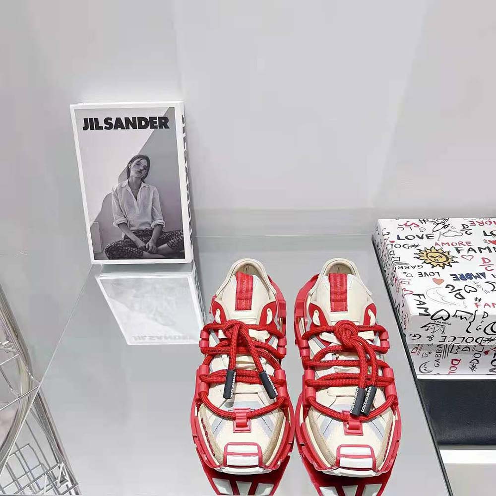 Close-up of signature D&G metal logo on red space sneakers