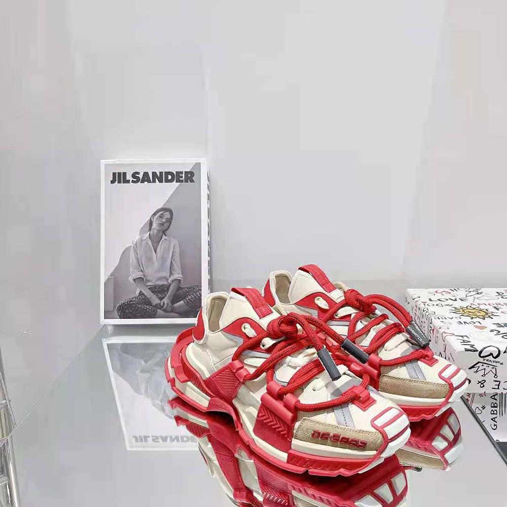 Top angle showing mixed leather and mesh details on red space sneakers