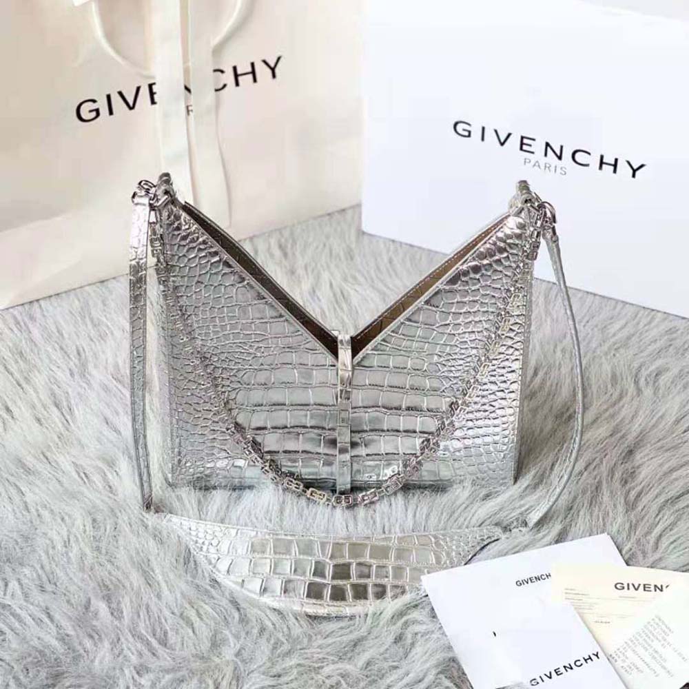 Close-up of silver chain and crocodile effect leather texture on Givenchy bag