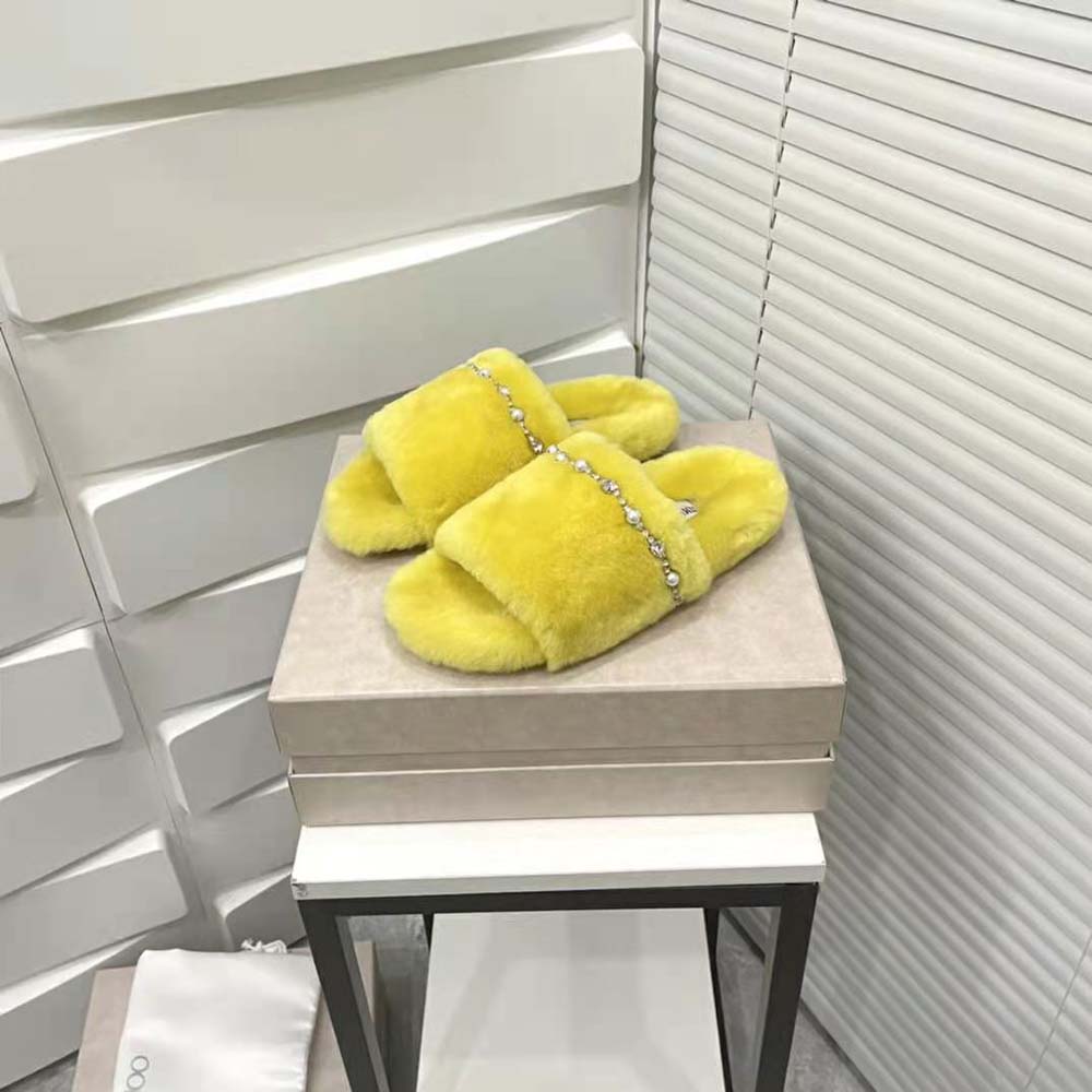 Side angle showing lime shearling material and flat sole of Jimmy Choo Acinda Slippers