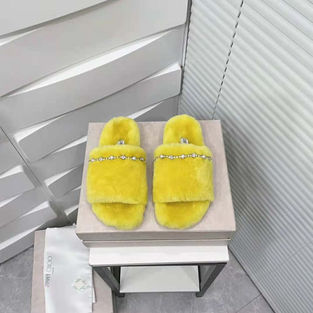 Close-up of crystal and pearl detailing on Jimmy Choo Acinda Shearling Slippers