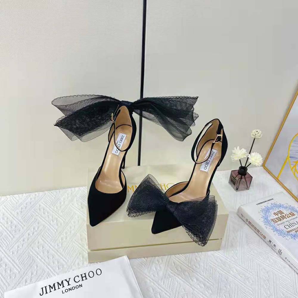 Close-up on asymmetric grosgrain mesh fascinator bows of Jimmy Choo Averly pumps