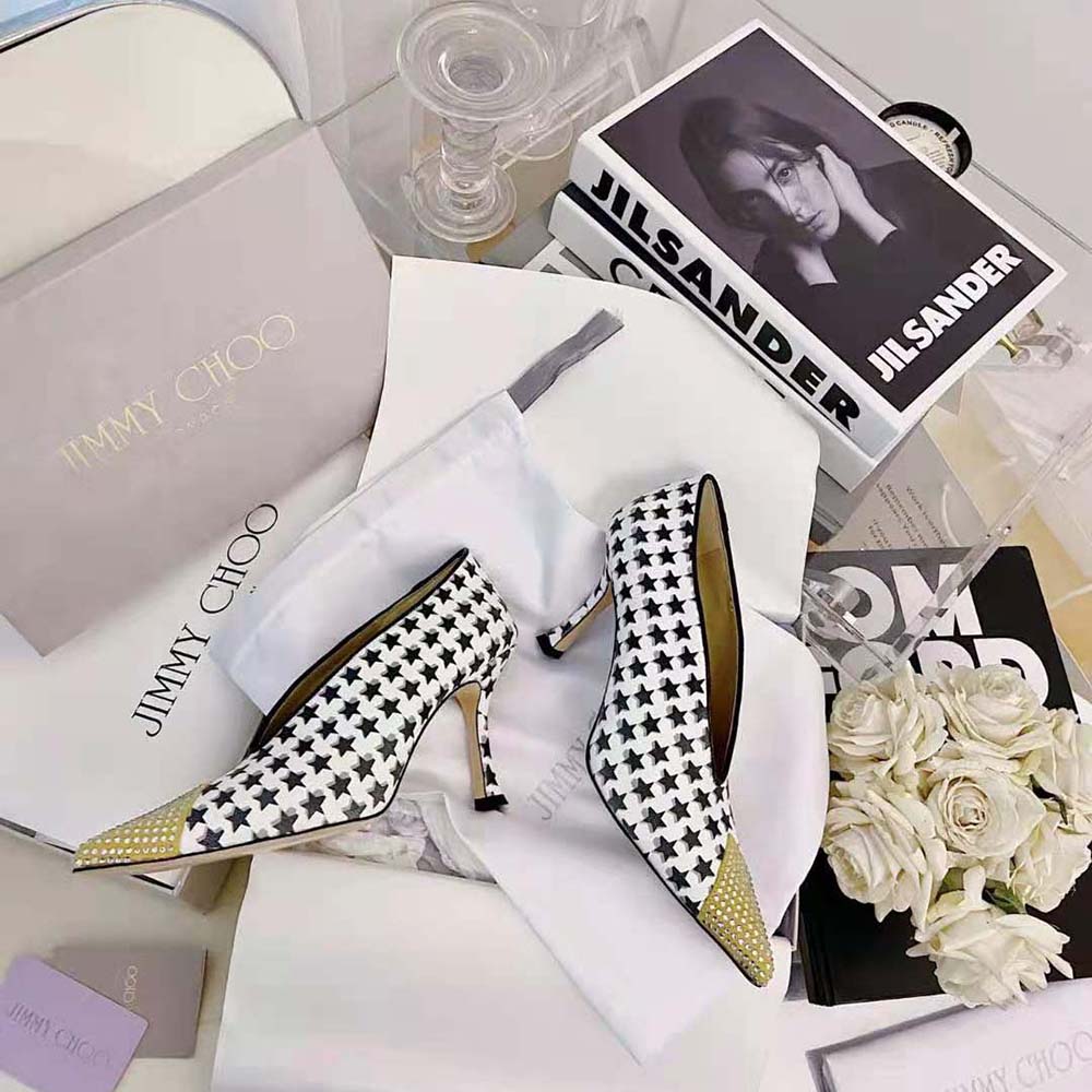 Rear angle showing 90mm stiletto heel and signature star on Jimmy Choo Nicole 90 pumps