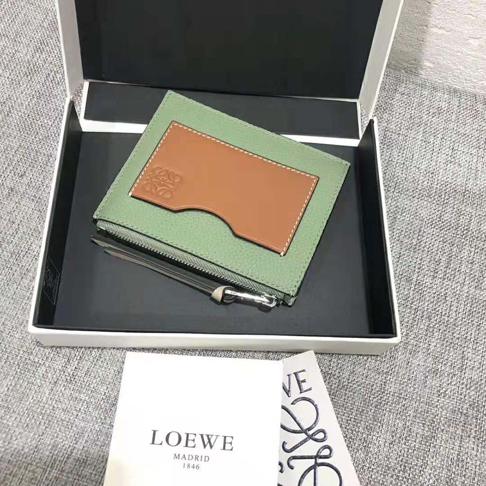 Side angle showing compact shape and zipper closure of Loewe cardholder