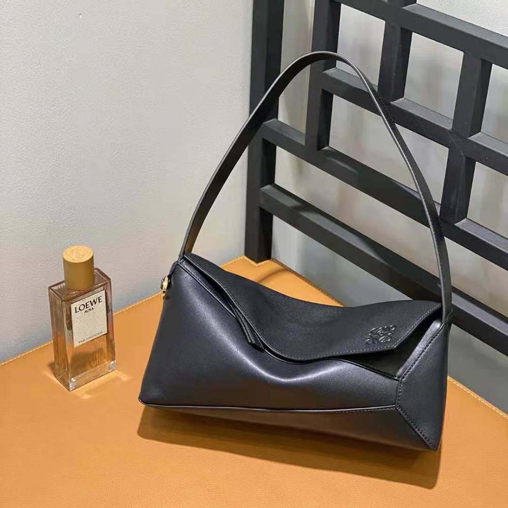 Side angle showing soft leather texture of Loewe Puzzle Hobo Bag