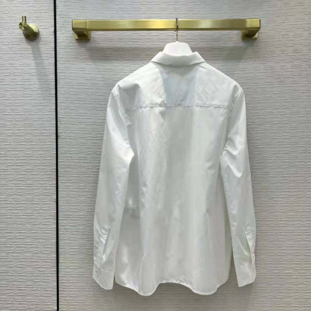 Side angle showing tailored fit of Prada Women Embroidered Poplin Blouse