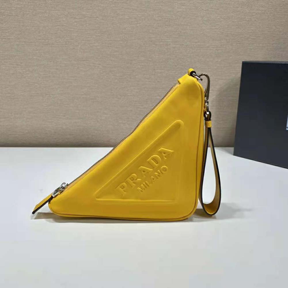 Side angle showing zipper and compact shape of Prada Yellow Leather Pouch