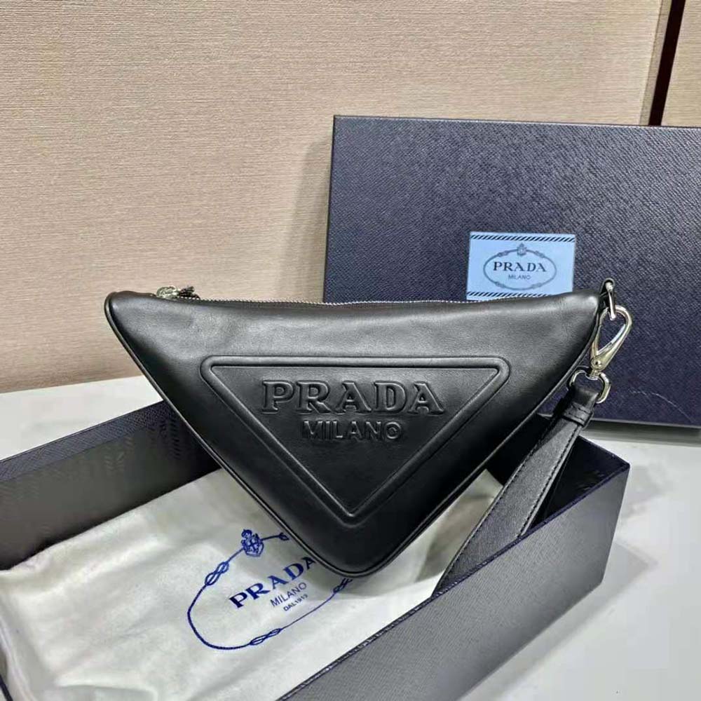 Close-up of smooth black leather and silver hardware on Prada pouch