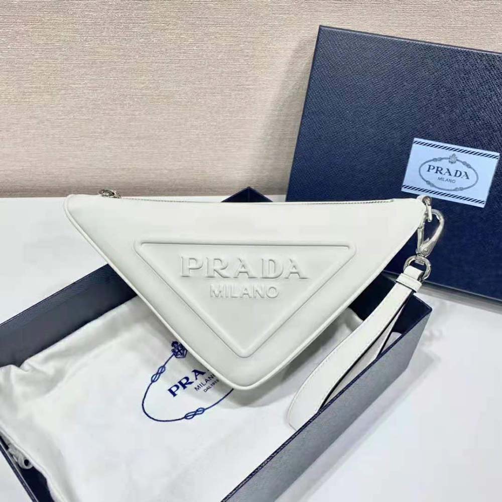 Close-up of silver zipper and white leather texture on Prada pouch
