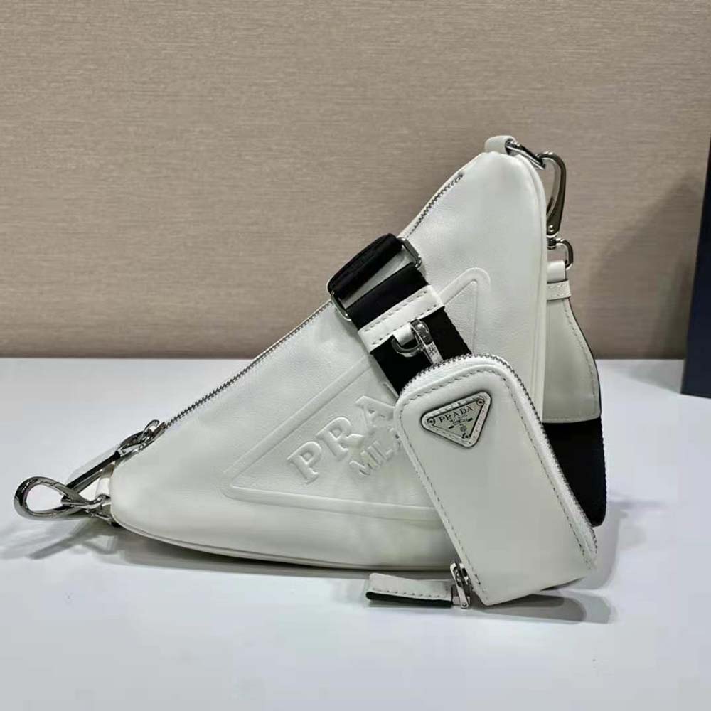 Close-up of silver hardware and magnetic flap on Prada Women Leather Triangle Shoulder Bag-White