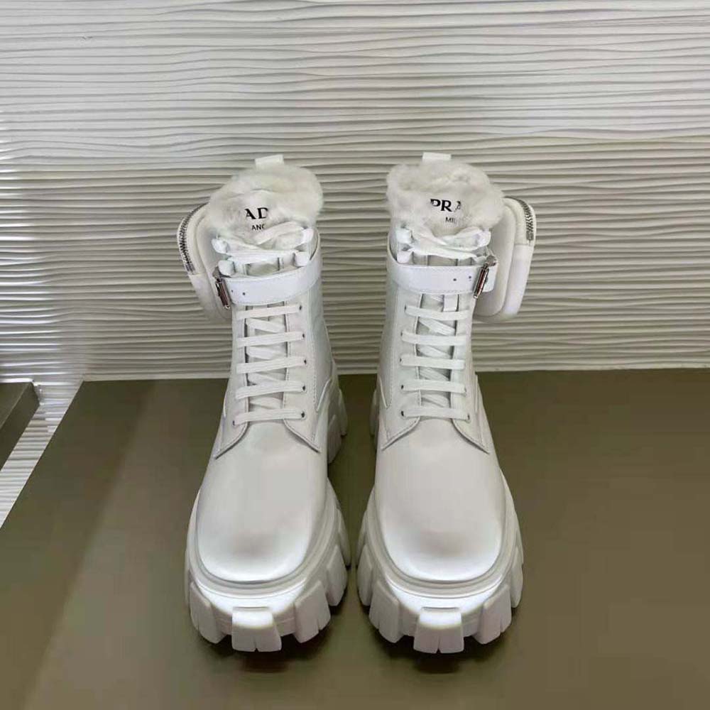 Side profile highlighting leather and nylon contrast on Prada Monolith Boots