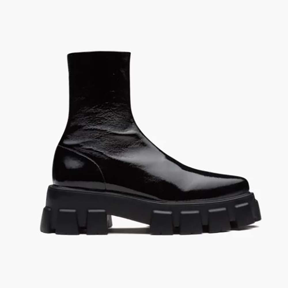Side view of Prada Women Monolith Pointy Technical Patent Leather Booties in black