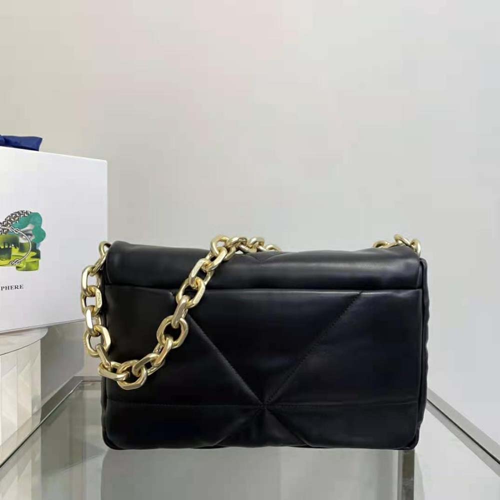 Side angle showing silver-tone hardware on Prada black shoulder bag