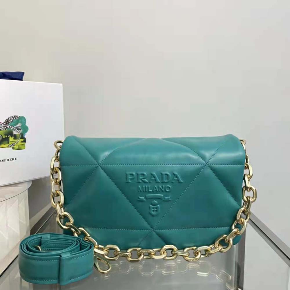 Close-up of silver-tone hardware and magnetic closure on Prada lime shoulder bag