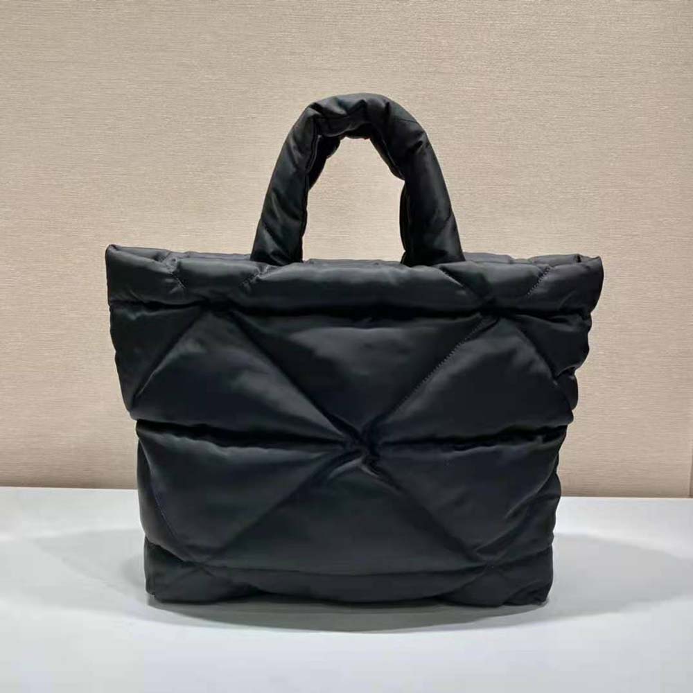 Side angle highlighting padded texture and zip closure on Prada tote