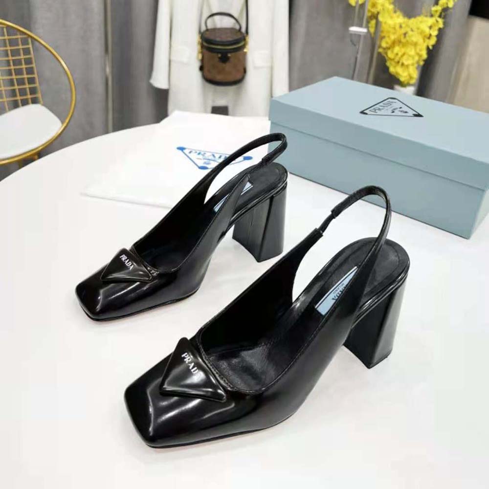 Close-up detail of sling-back strap and buckle on Prada pumps