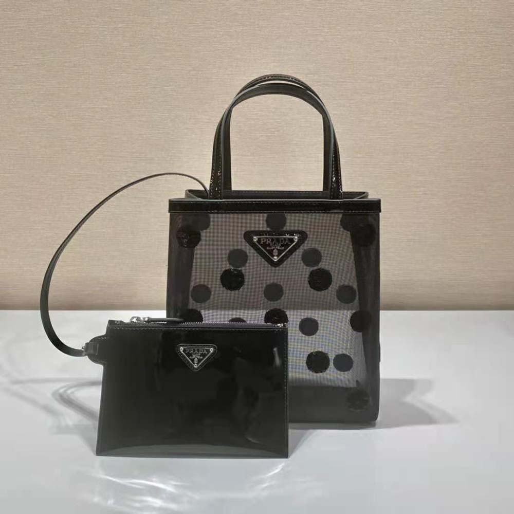 Close-up on silver-tone hardware of Prada Women Small Polka-Dot Mesh Tote Bag-Black