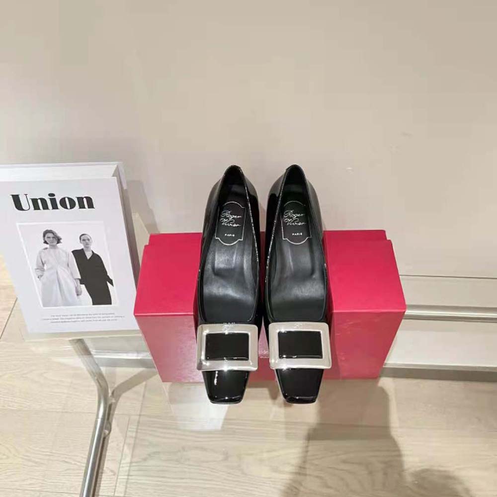 Close-up of signature metal buckle on Roger Vivier Belle Vivier pumps