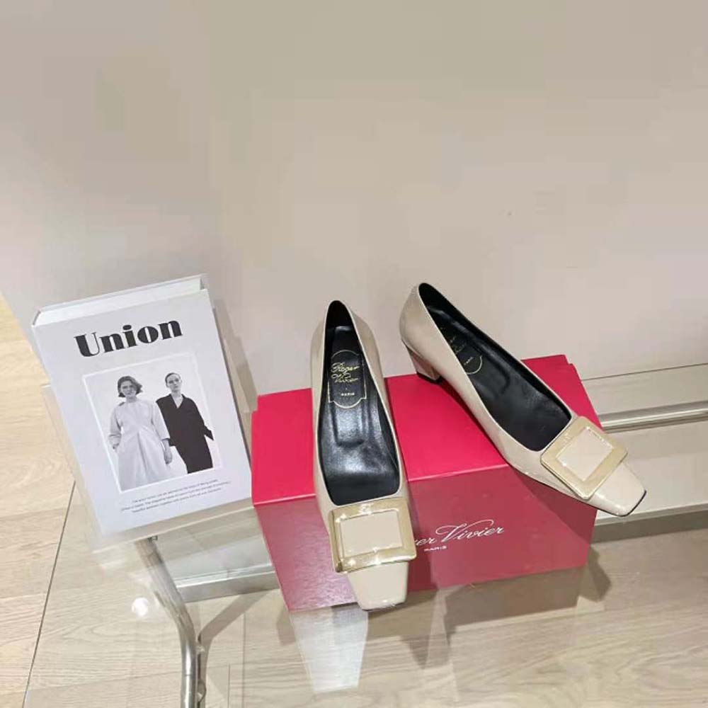 Top-down angle showing brown patent leather and silhouette of Belle Vivier Pumps