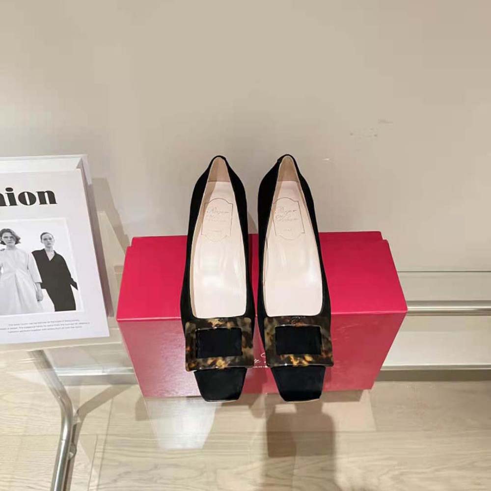 Close-up of signature turtle buckle on Roger Vivier Belle Vivier pumps