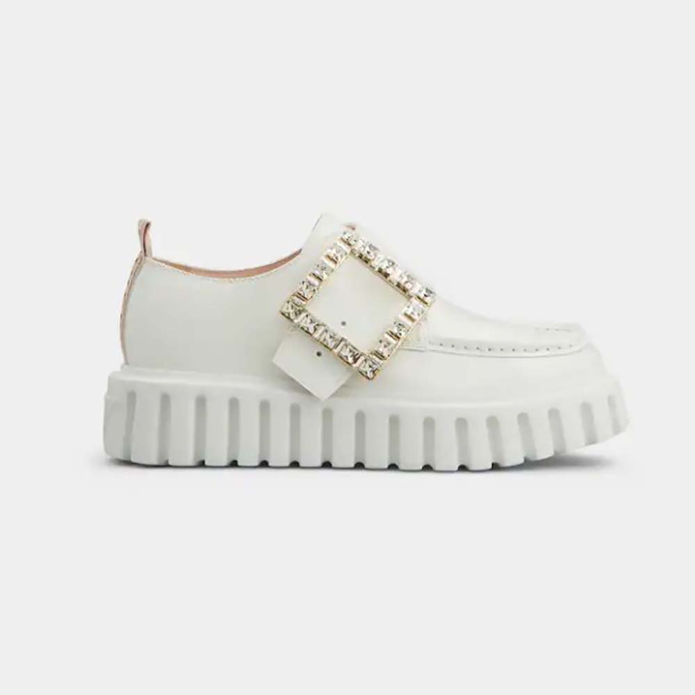 Side view of Roger Vivier Viv’ Go-Thick Strass Buckle Loafers in white patent leather