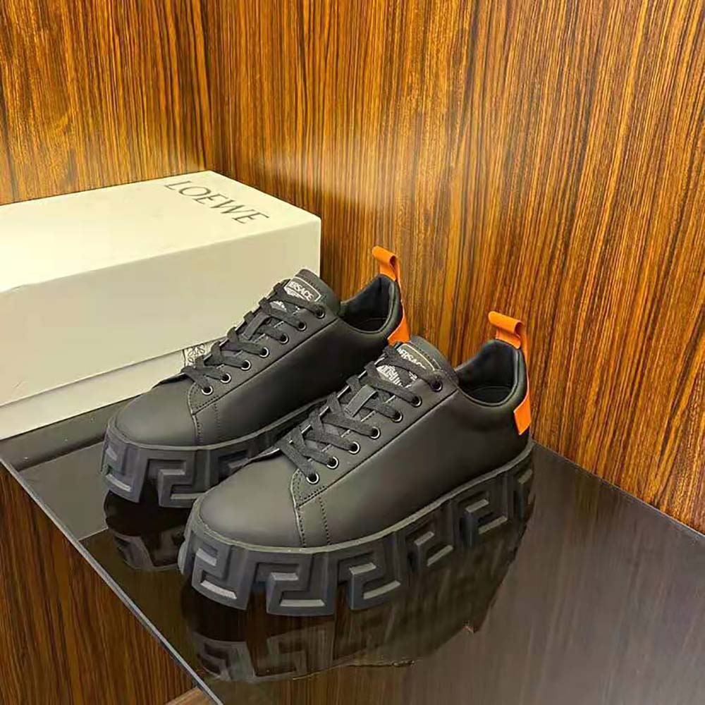 Close-up of embossed Greca labyrinth detailing on Versace Men Greca Labyrinth Trainers-Black