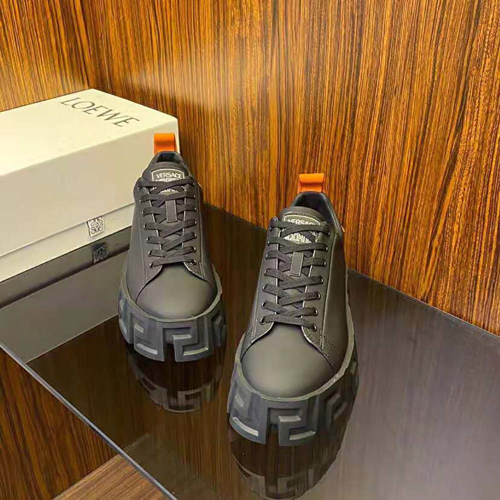 Top-down view showing laces and leather texture of Versace Men Greca Labyrinth Trainers-Black