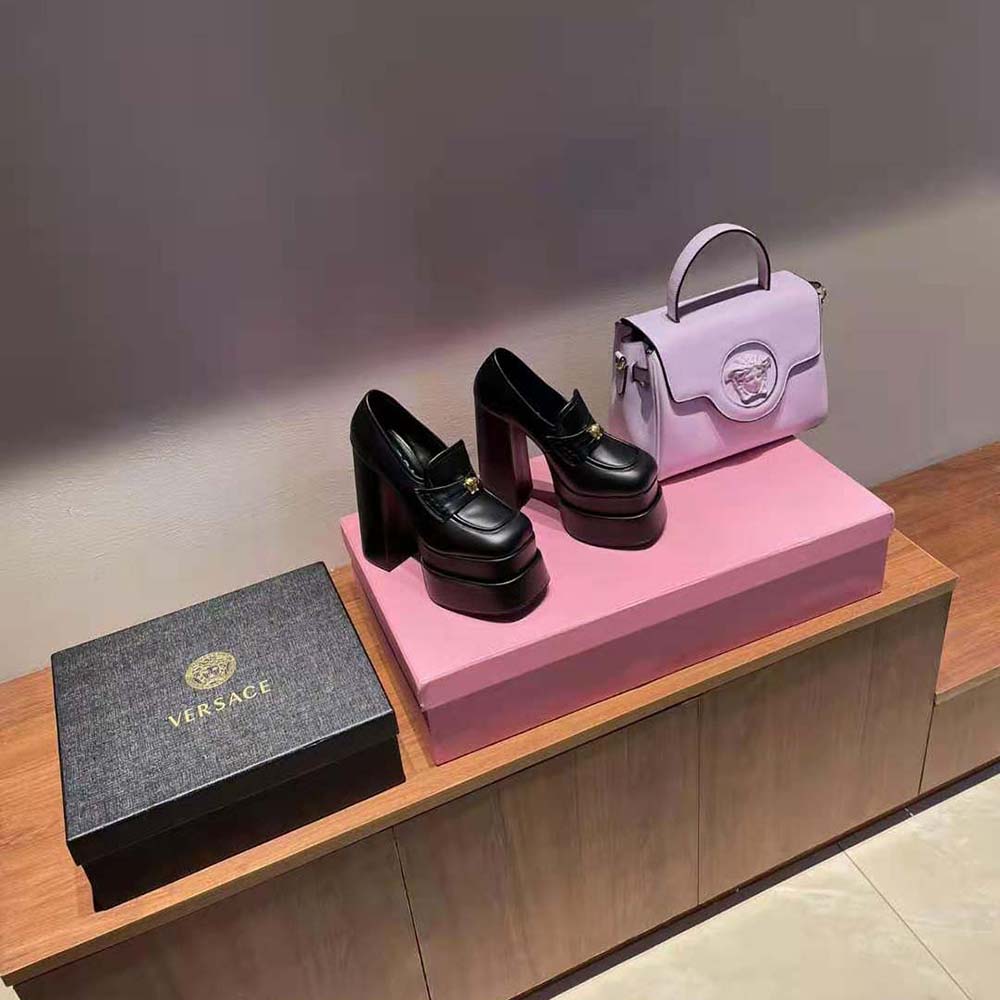 Front view showing sleek silhouette of Versace Women Intrico Platform Loafers black