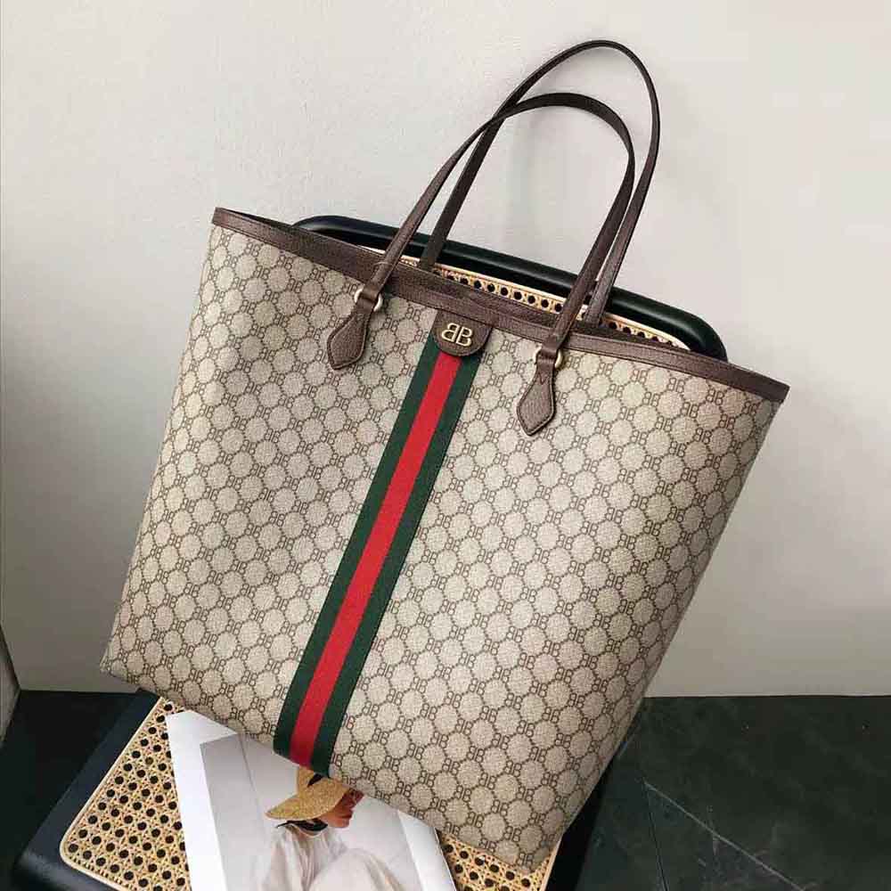 Close-up of bold oversized logo hardware on Balenciaga Men Hacker Large Tote Bag