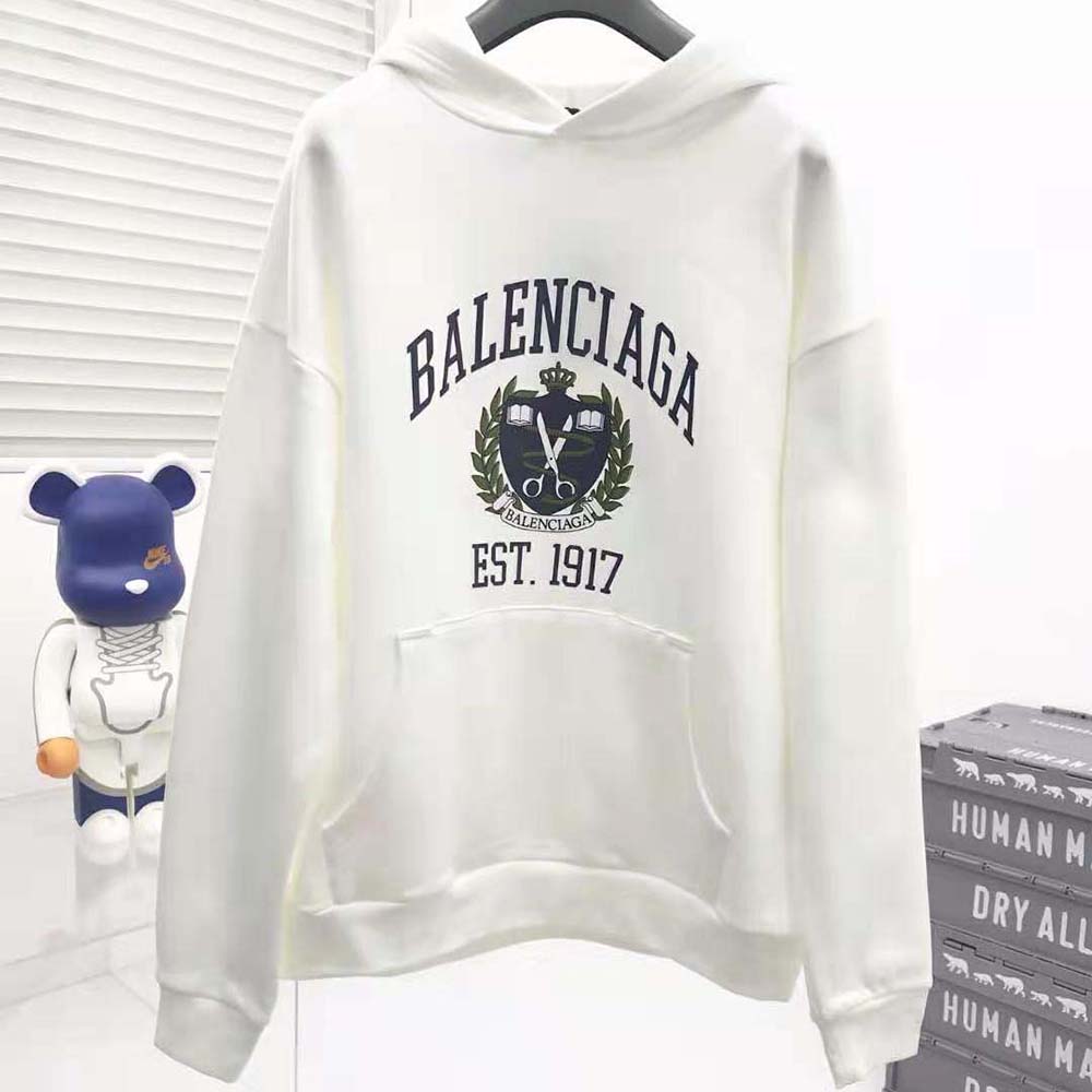 Close-up of Balenciaga logo hardware on wide fit hoodie sleeve