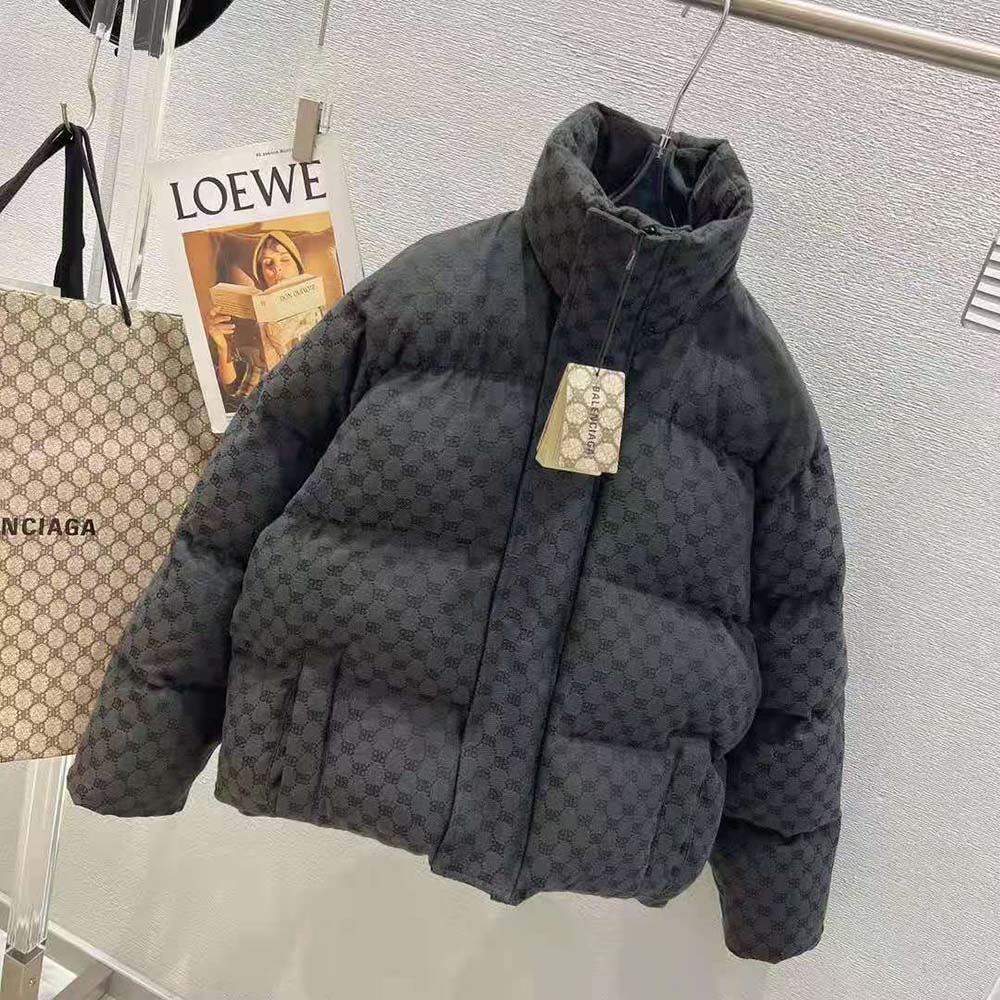 Close-up of signature logo hardware on Balenciaga Men Hacker BB Puffer coat