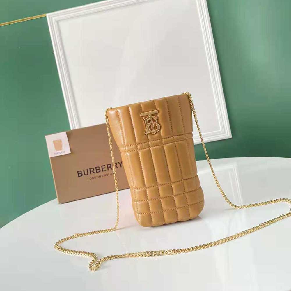 Close-up of gold-tone hardware on Burberry Micro Quilted Lambskin Lola Bucket Bag-Brown