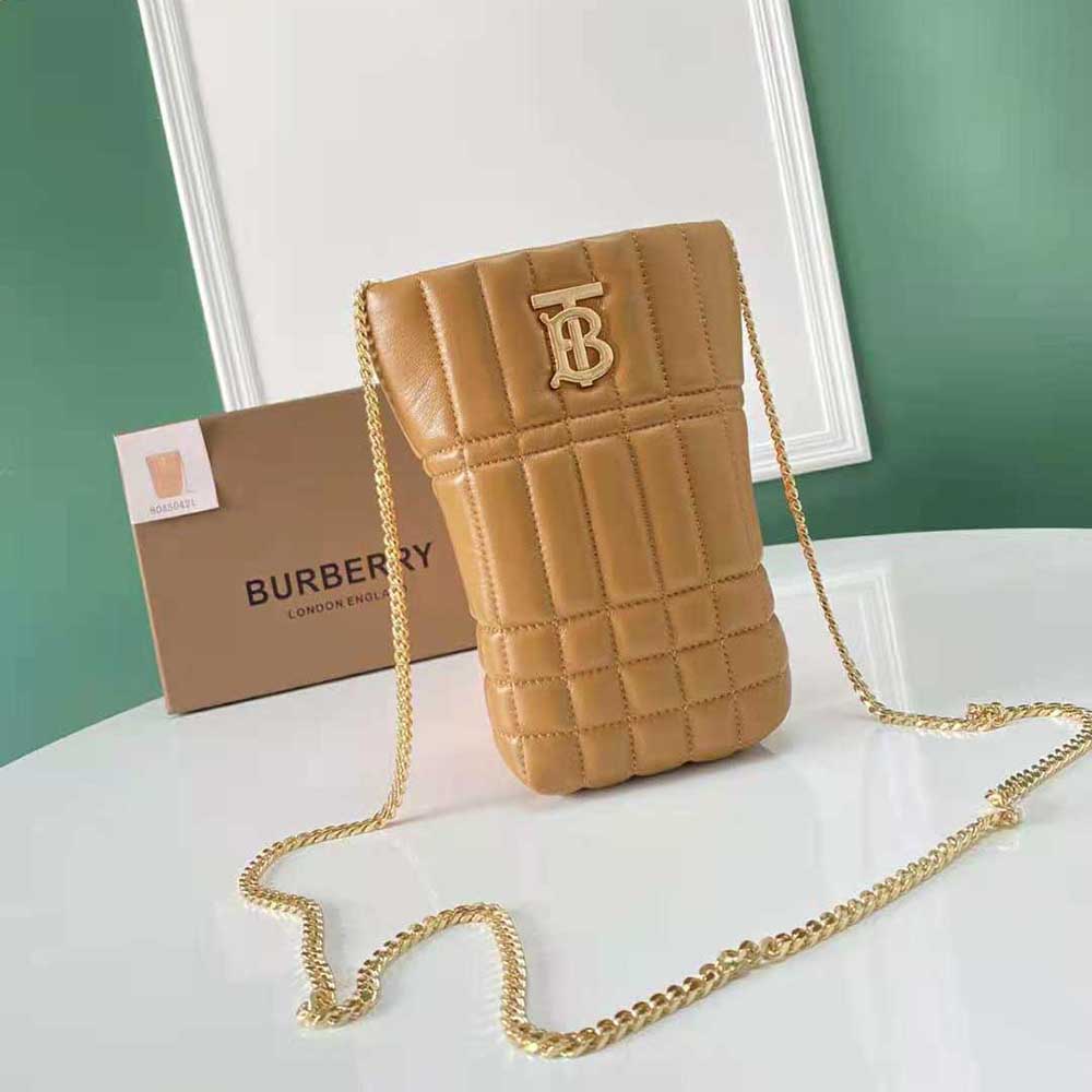 Side angle showing micro quilted texture on Burberry Women Lola Bucket Bag-Brown