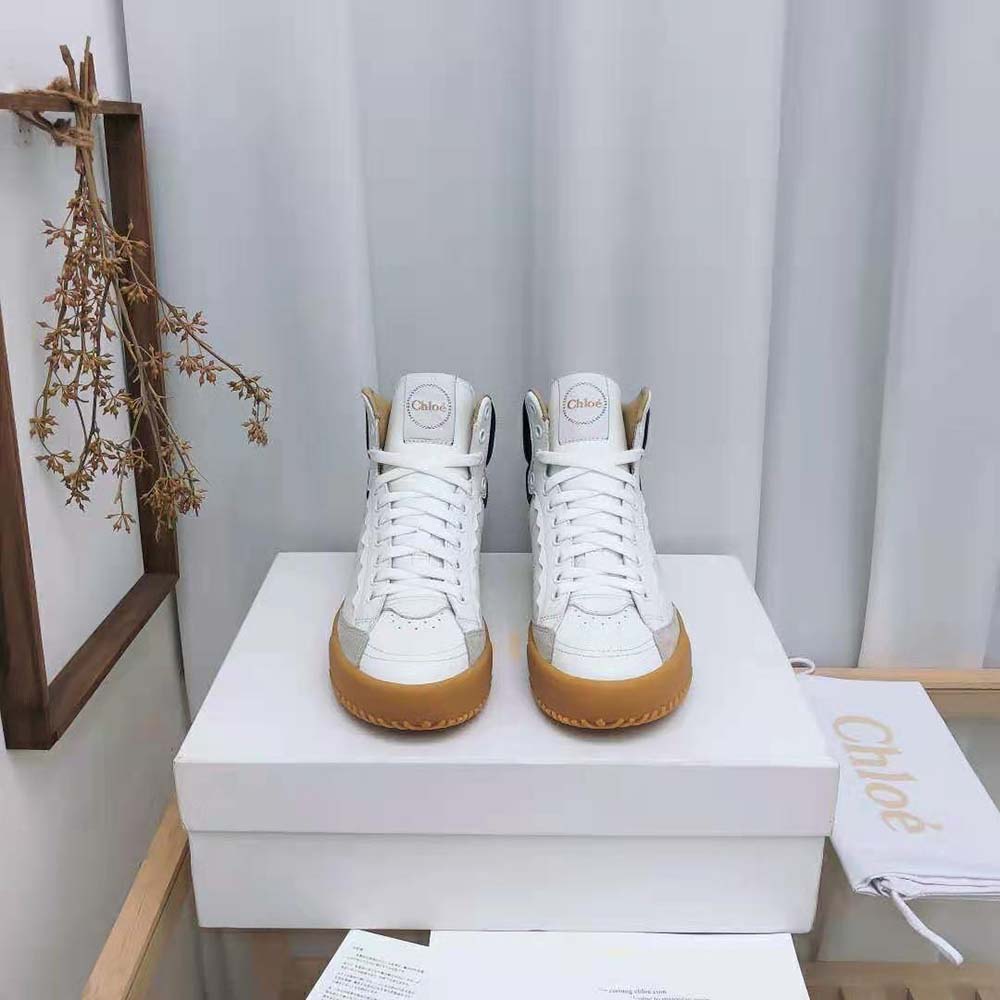 Close-up of gold-toned Chloé hardware on Franckie High-Top Sneaker