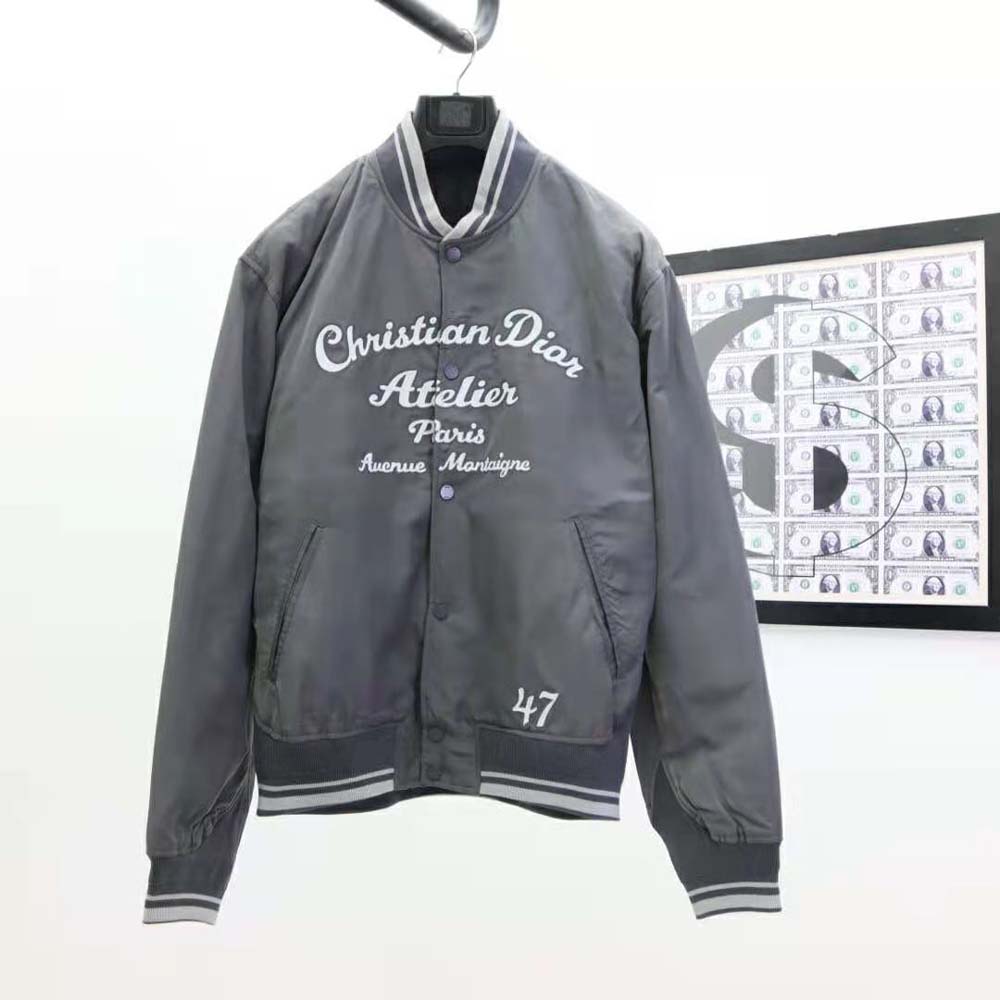 Close-up on silver technical faille fabric and Dior-branded zipper pull