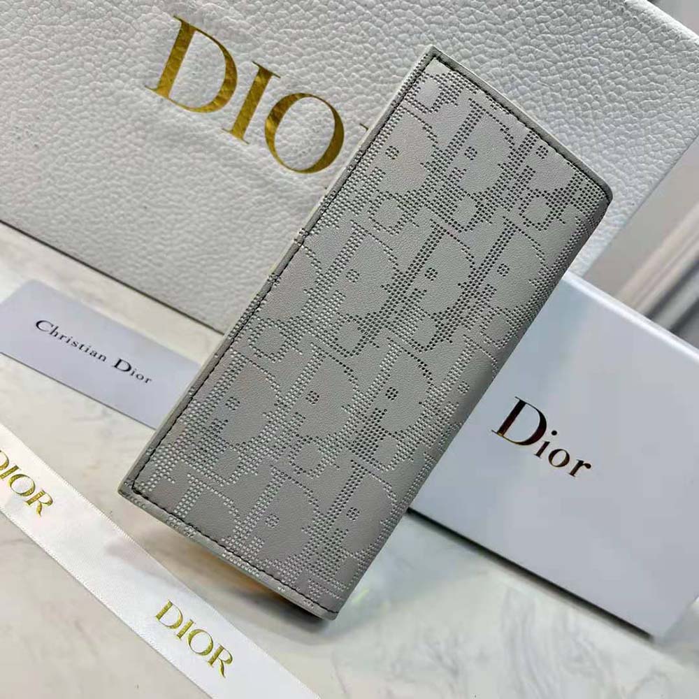 Side angle showing slim profile of Dior Men Vertical Long Wallet Gray Dior Oblique Galaxy Leather