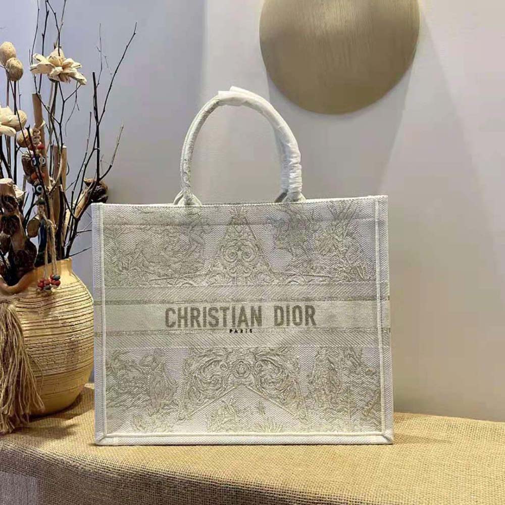 Close-up of gold-tone hardware and Stella embroidery detail on Dior tote