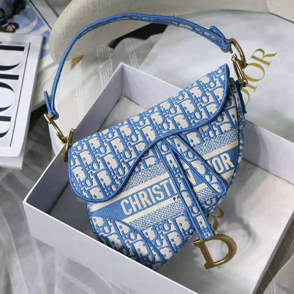 Close-up of embroidered Dior Oblique pattern on Saddle Bag in blue