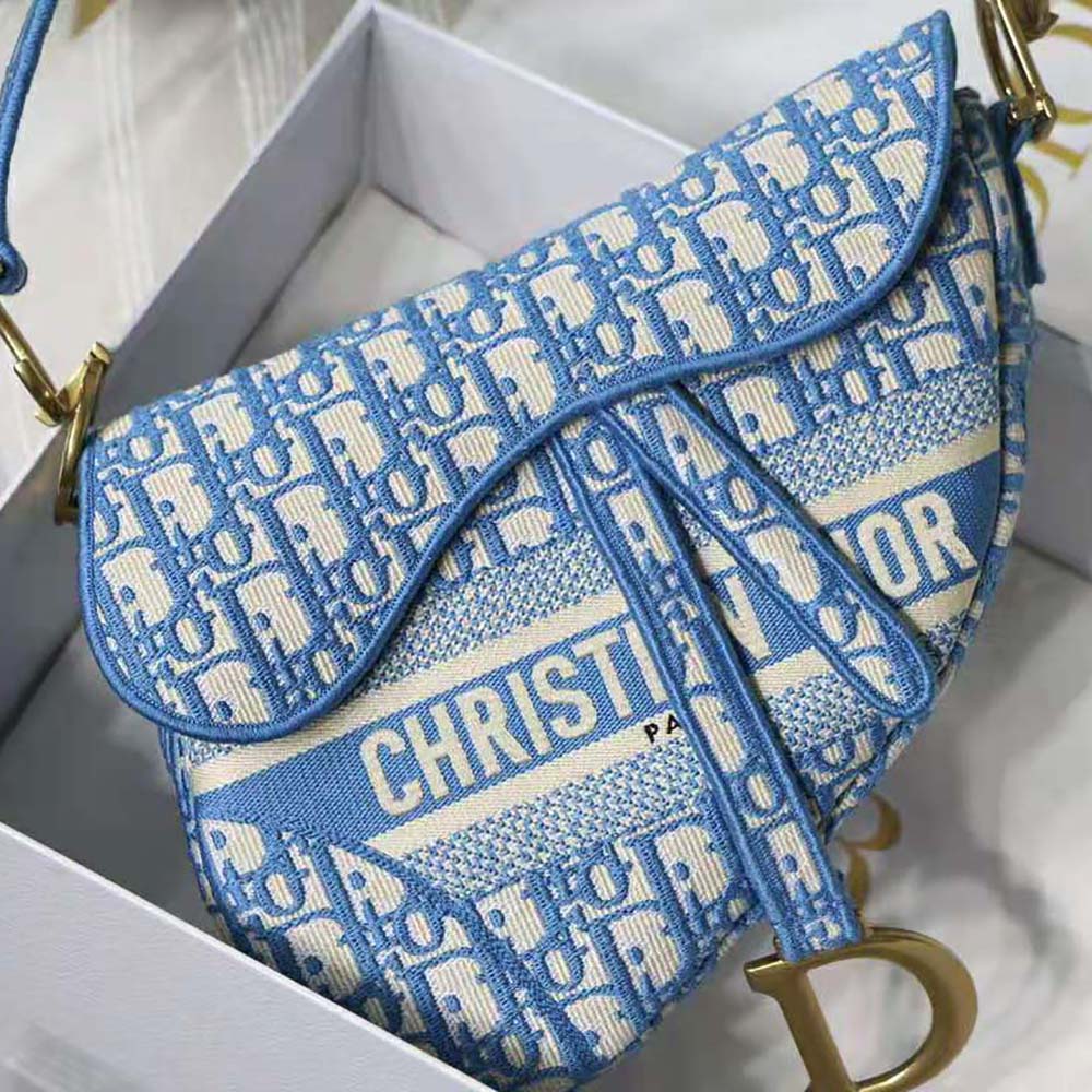 Side angle showing silver-tone clasp detail on Dior Women Saddle Bag