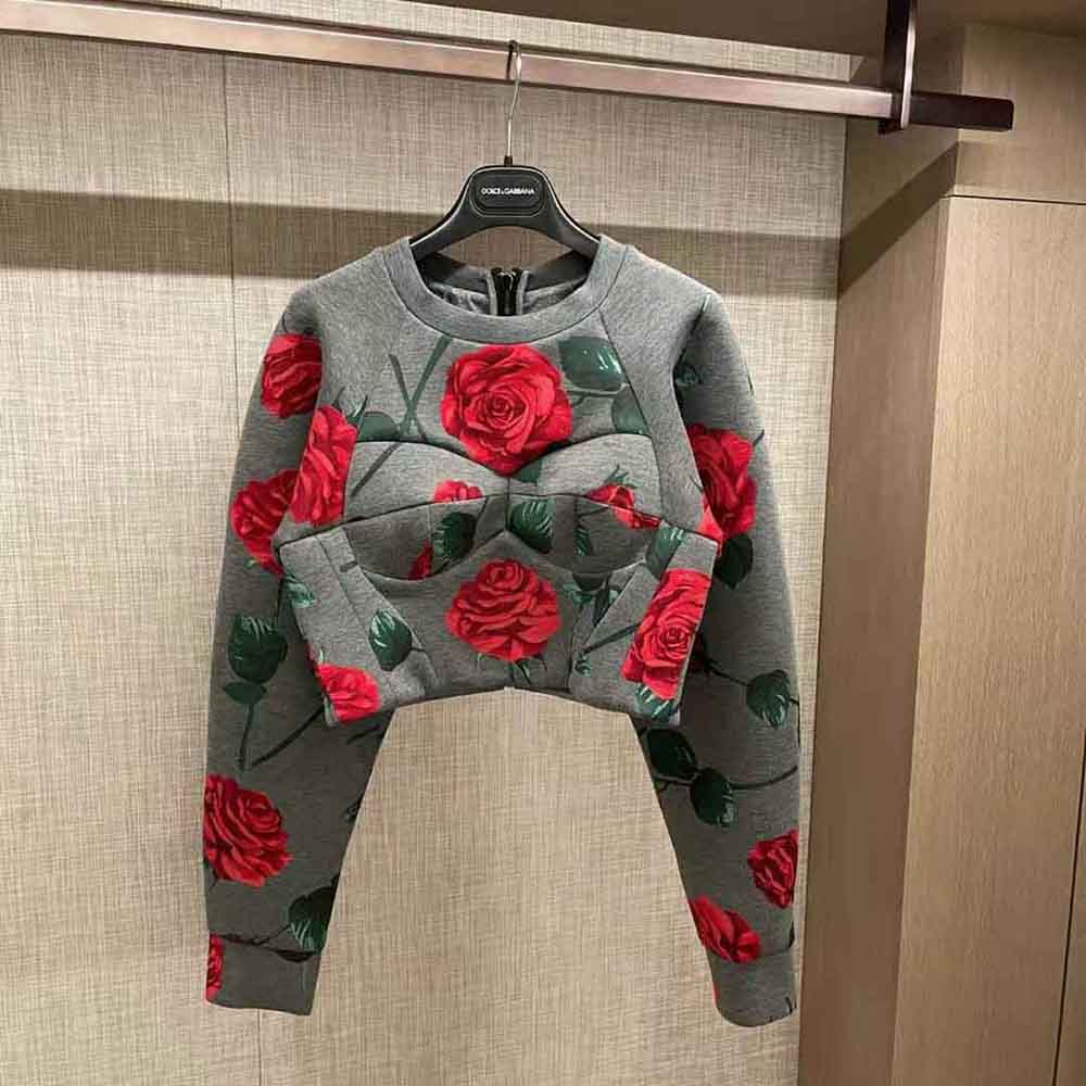Close-up of flocked rose print on Dolce Gabbana D&G sweatshirt bustier detail