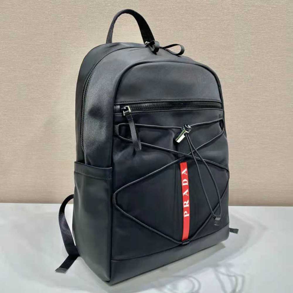 Side angle showing zipper and adjustable straps on Prada Men Technical Fabric Backpack